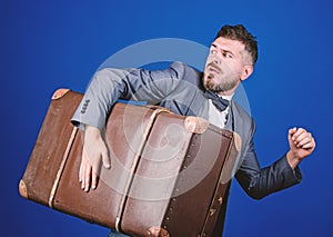 Thief run away with heavy suitcase. Theft of century. Delivery service. Travel and baggage concept. Hipster traveler