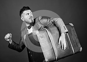 Thief run away with heavy suitcase. Theft of century. Delivery service. Travel and baggage concept. Hipster traveler