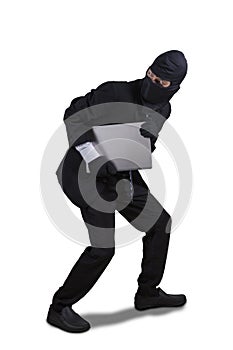 Thief running with laptop isolated photo