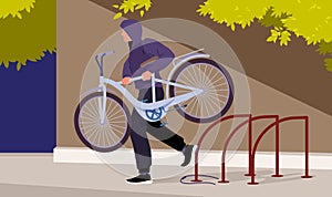 Thief stealing bicycle from rack in public city area, bike theft on street. Man carrying stolen personal transport and