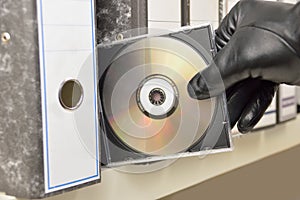 Thief stealing documents in compact disc