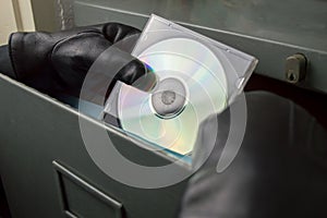 Thief stealing documents in compact disc