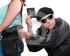 Thief stealing from handbag. photo