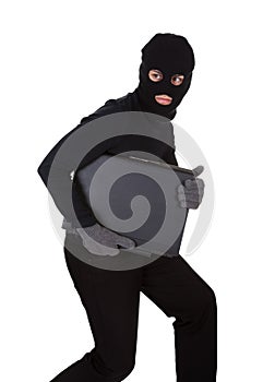 Thief stealing a laptop computer