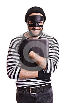 Thief stealing a laptop computer