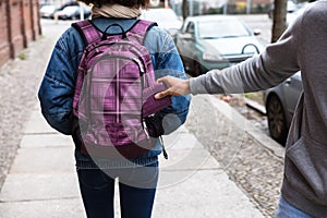 Thief Stealing Purse From Backpack