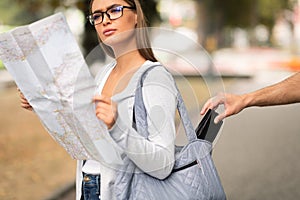 Thief Stealing Wallet From Tourist Girl`s Bag Standing Outdoor, Cropped