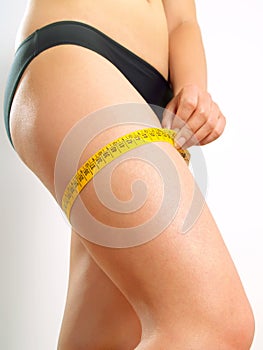 Thigh measuring on a woman's leg photo