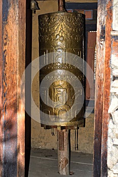 Buddhist prayer wheel close-up in a temple photo