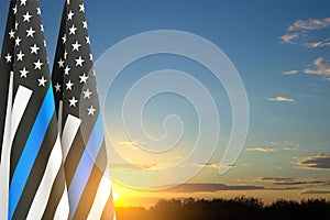 Thin Blue Line. American flag with police blue line on a background of sunset