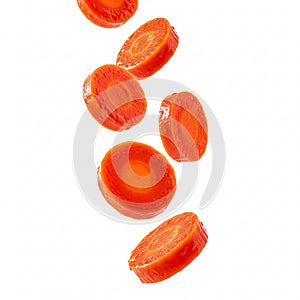 Thin carrot slices, falling, creating a dynamic and fresh image