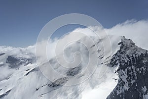 Thin clouds shadows snow on Fastness peak, from east, New Zealand photo