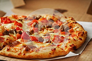 Thin crust Pizza, close up photo of a delicious pizza with mozzarella cheese, onions, meat, tomato