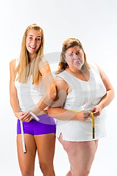 Thin and fat woman measuring waist with tape