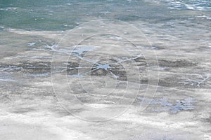 Melting thin ice in the pond.