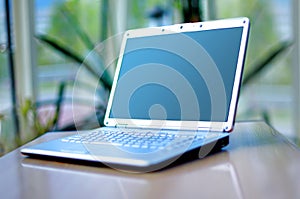 Thin laptop on office desk