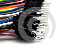 Thin multicolored wires with connectors, arduino wire on white background