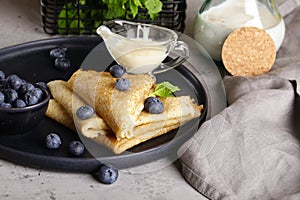 Thin pancakes with blueberries