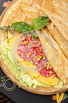 Thin pancakes with cheese