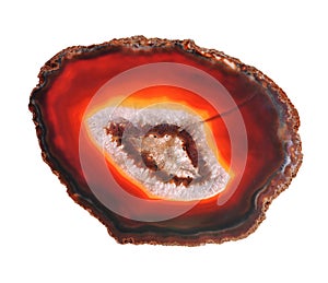 Thin polished red slice of agate geodes with concentric layers isolated over a white