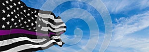 Thin Purple Line USA flag waving at cloudy sky background on sunset, panoramic view. Politicians Killed, Wounded in Office flag.