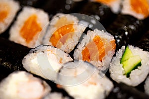 Thin rolls with salmon,cucumber,shrimp close up