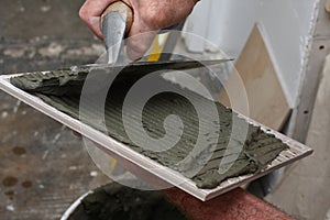 Thin set mortar spread on tile