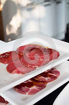 Thin slice meat for Korean Barbecue on a white plate