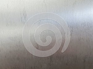 A thin, smooth background sheet of stainless steel, iron, aluminum. There is a small pattern with a few black stains when passing