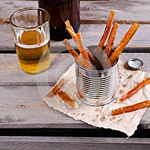 Thin sticks of smoked fish