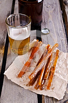 Thin sticks of smoked fish