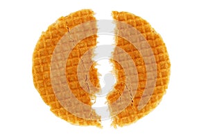 Thin waffles with caramel in a fault on a white background