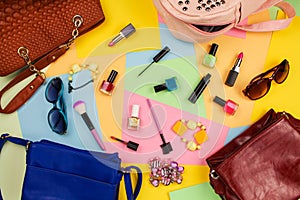 Things from open lady purses. Cosmetics and women`s accessories