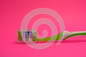 Things, personal hygiene products, new toothbrush placed on pink background.