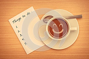 Things To Do List on paper with coffee cup