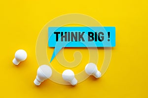 Think big,Great idea,Business creativity concepts with lightbulb and text on yellow background