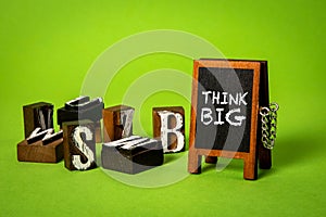 Think Big. Miniature chalkboard with text on a green background