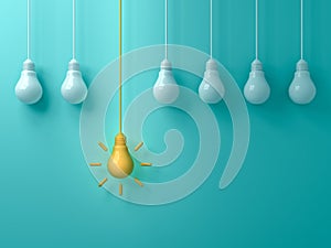 Think different concept One hanging yellow idea light bulb standing out from white unlit bulbs on blue green pastel