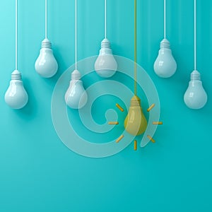 One hanging yellow idea light bulb standing out from white unlit bulbs on blue green pastel color background