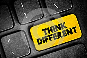 Think Different text button on keyboard, concept background
