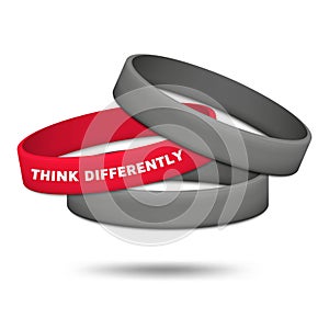 Think differently concept. Be different and individuality. Multicolored rubber wristbands