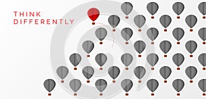 Think differently concept. Hot air balloon changing direction