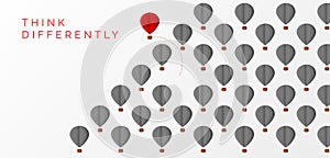 Think differently concept. Hot air balloon changing direction photo