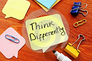 Think Differently motivation quote on the table