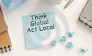 think globally act locally text concept write on wall paper