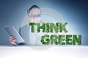 Think green ecological concept with businesswoman