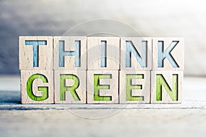 Think Green Written On Wooden Blocks On A Board