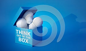 Think out of the box concepts with lightbulb. in box