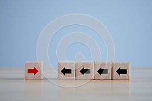 Think outside the box. Red arrow has different direction black arrow. disruption. unique. individuality concept.