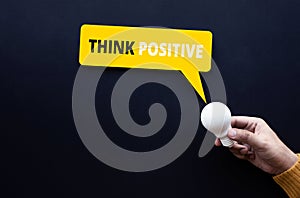 Think positive and creativity concepts with text and lightbulb on person